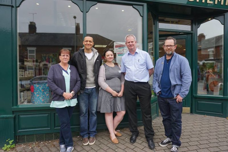 Clive with councillors and pharmacists outside Hurn Chemist
