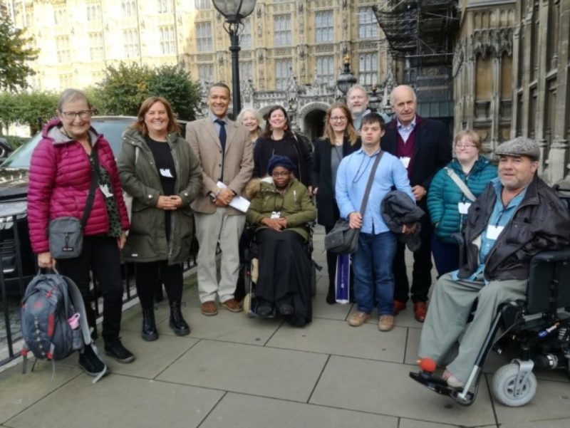 Clive with constituents affected by care cuts in parliament