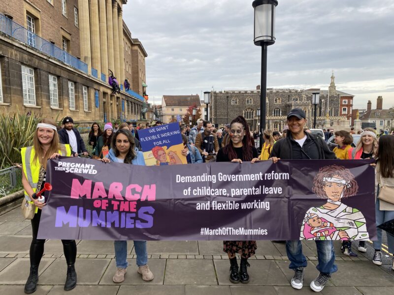  An image of Clive Lewis MP stood alongside campaigners for universal childcare in Norwich, October 2022